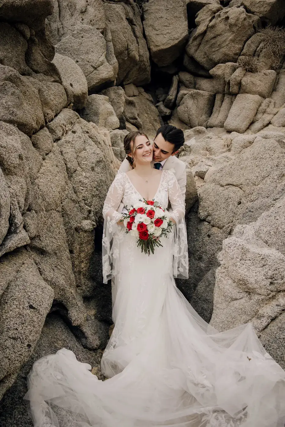 Wedding couple in editorial fashion at a Cabo beach