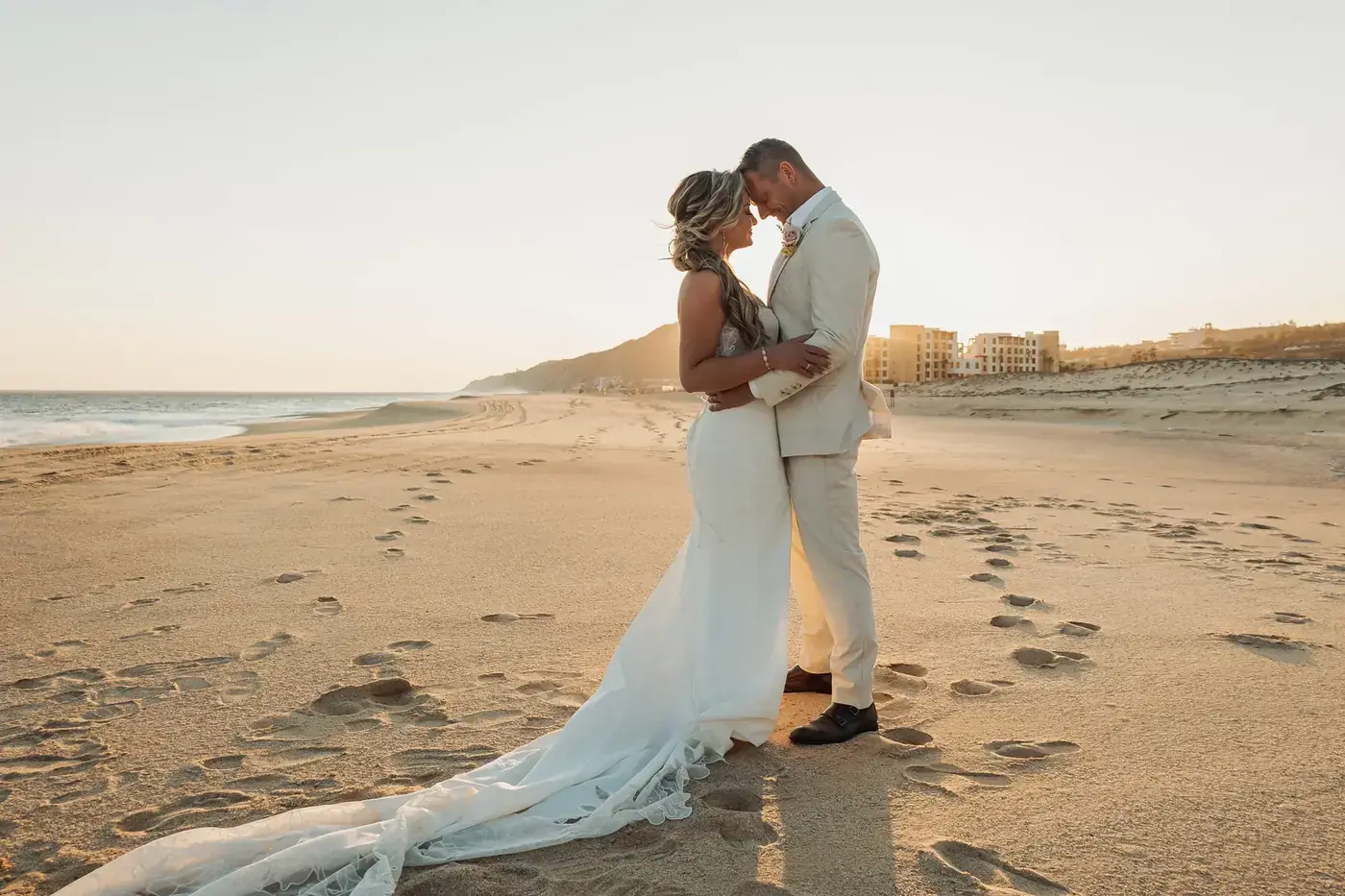Cabo wedding couple walk ocean