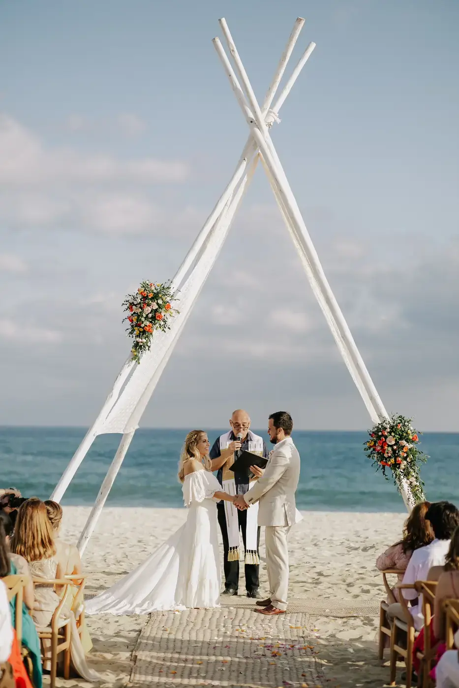 Beach wedding first kiss in Cabo San Lucas