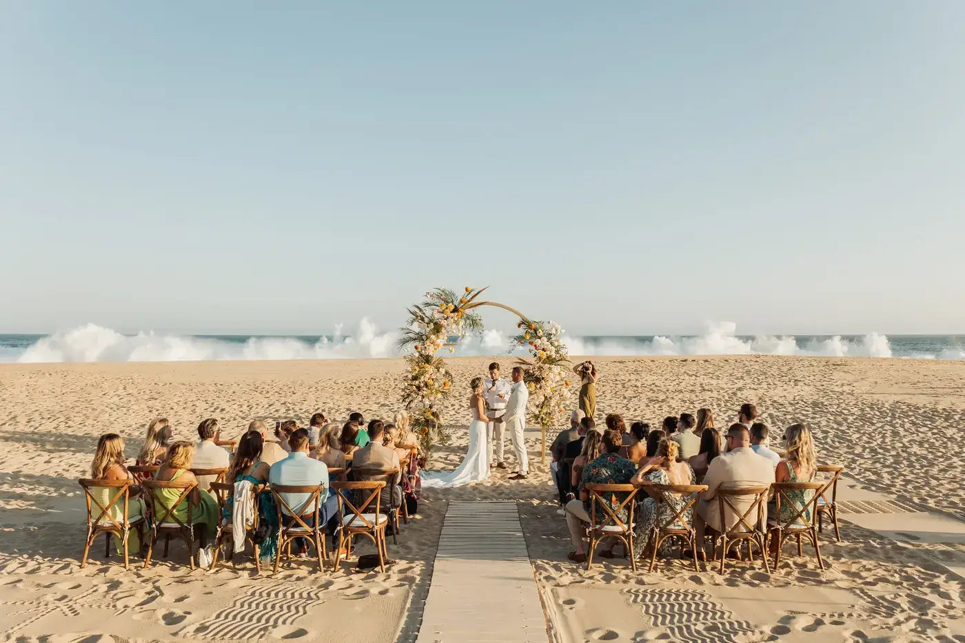 Couple laughing in golden hour light at a Cabo wedding