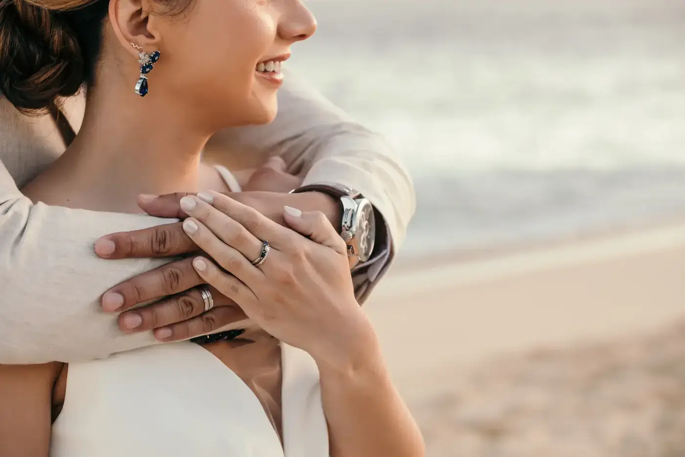 Close portrait of the couple's hands and rings at a Cabo wedding