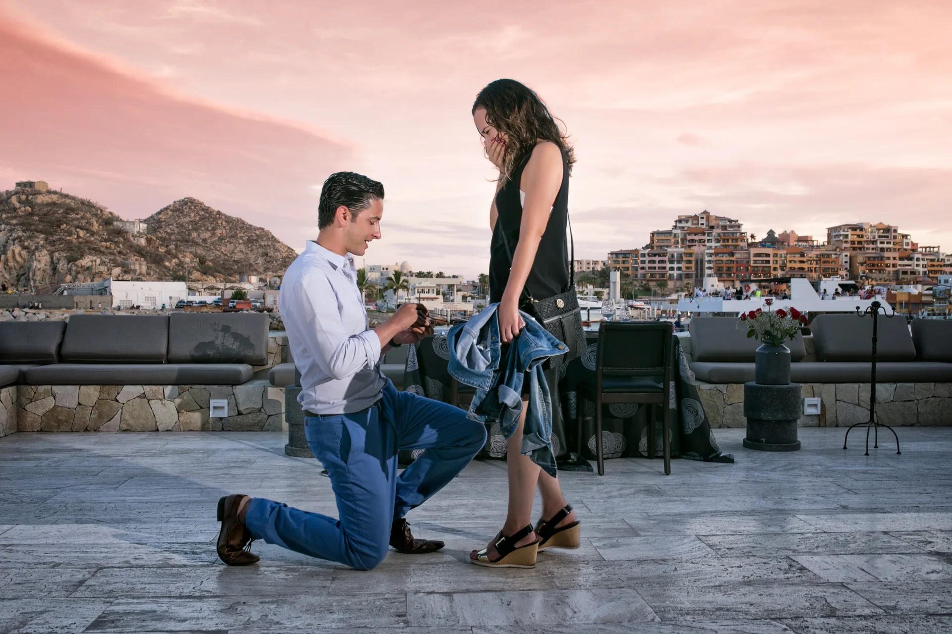 Surprise proposal on the rooftop at Breathless Cabo San Lucas at sunset
