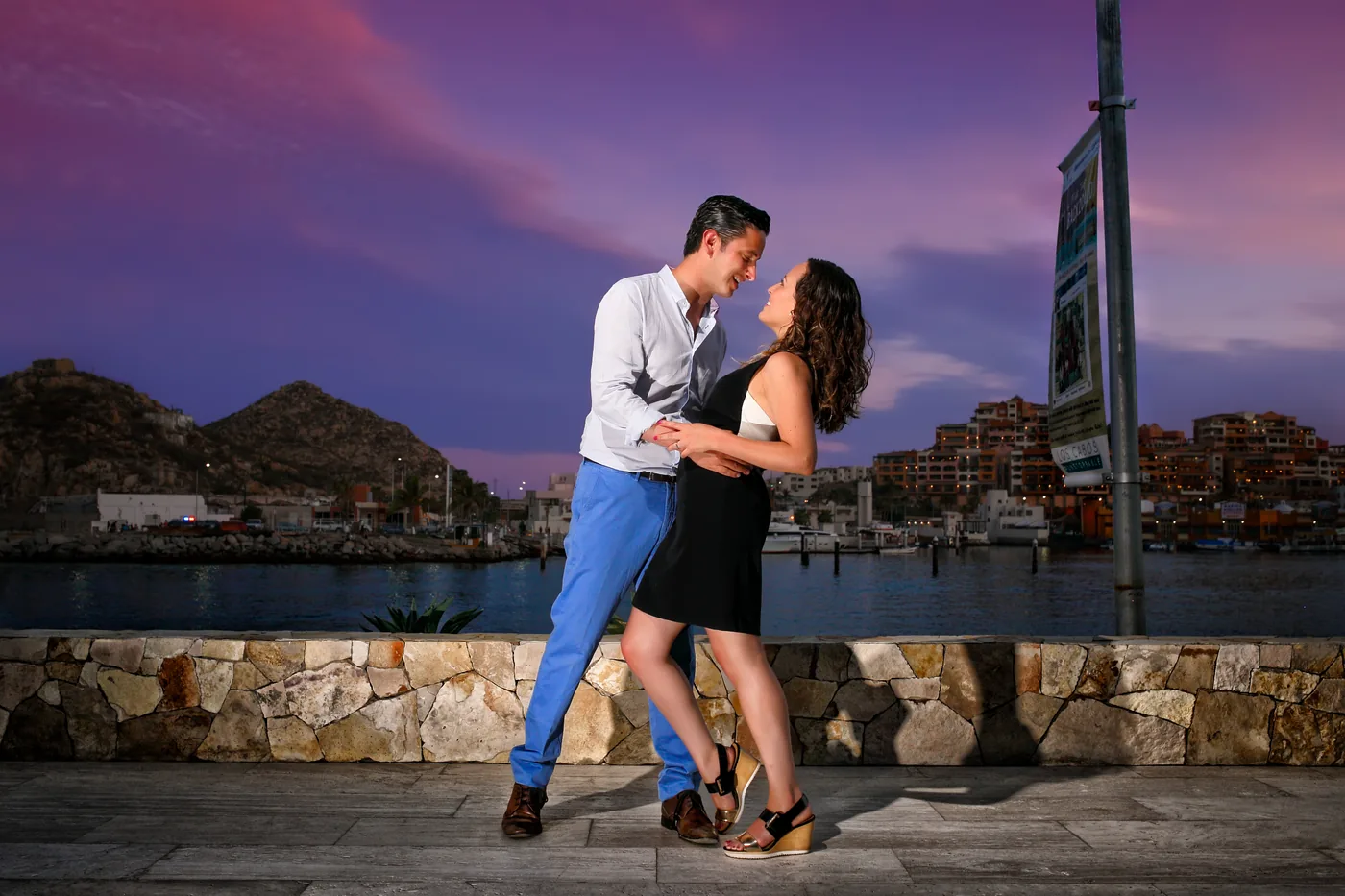 Engaged couple in front of the tower at Breathless Cabo San Lucas