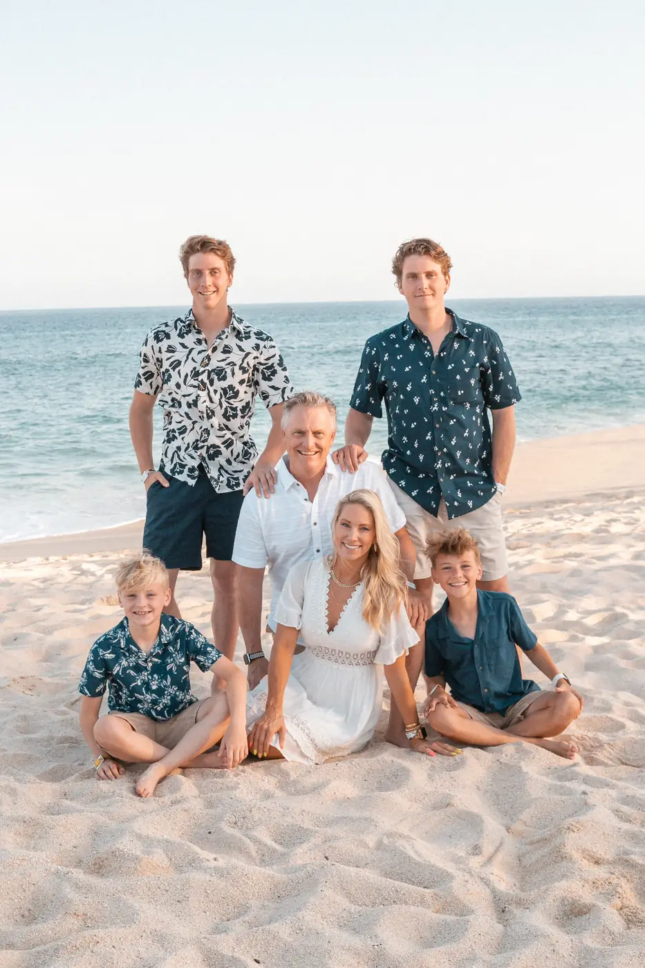 Family portrait at sunset on the beach, Los Cabos