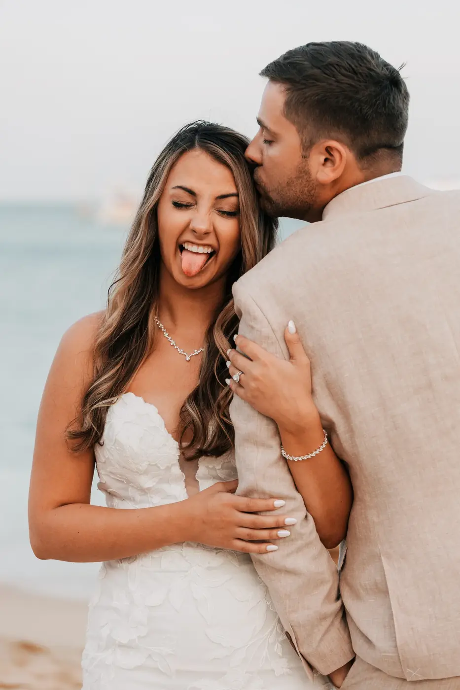 Couple embracing at their wedding reception in Los Cabos