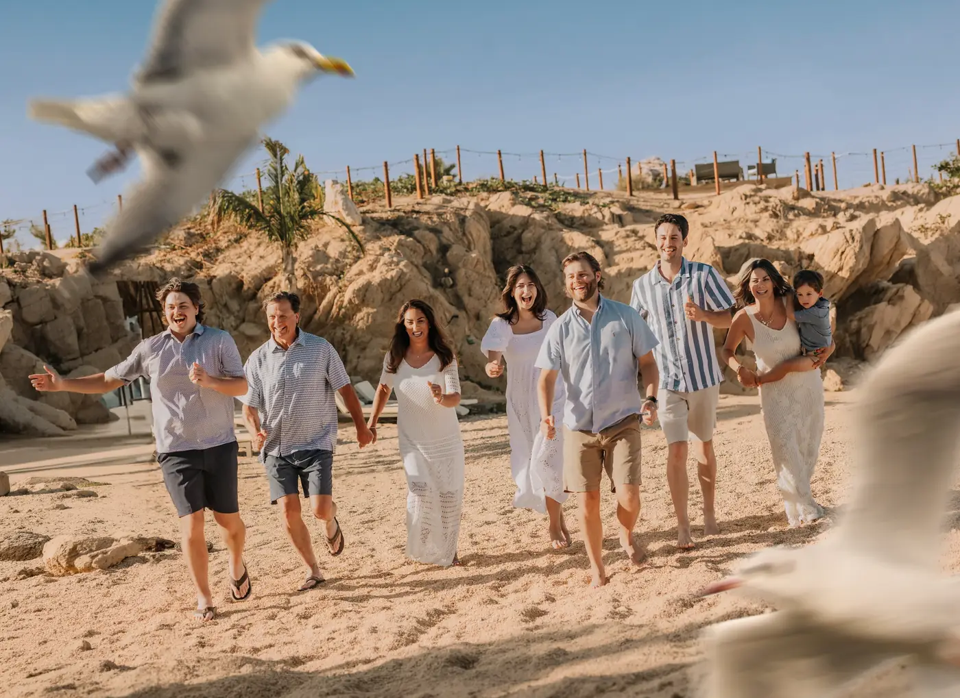 Wedding party celebrating on the beach, Los Cabos wedding photography