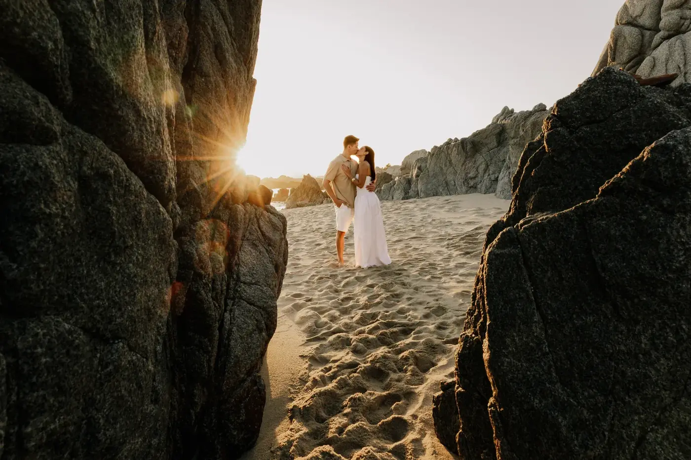 Bride and groom portrait in a rock cove at sunset, Cabo San Lucas wedding photography