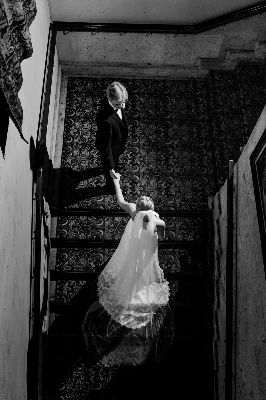 Black and white bride with veil on a staircase, editorial Cabo wedding