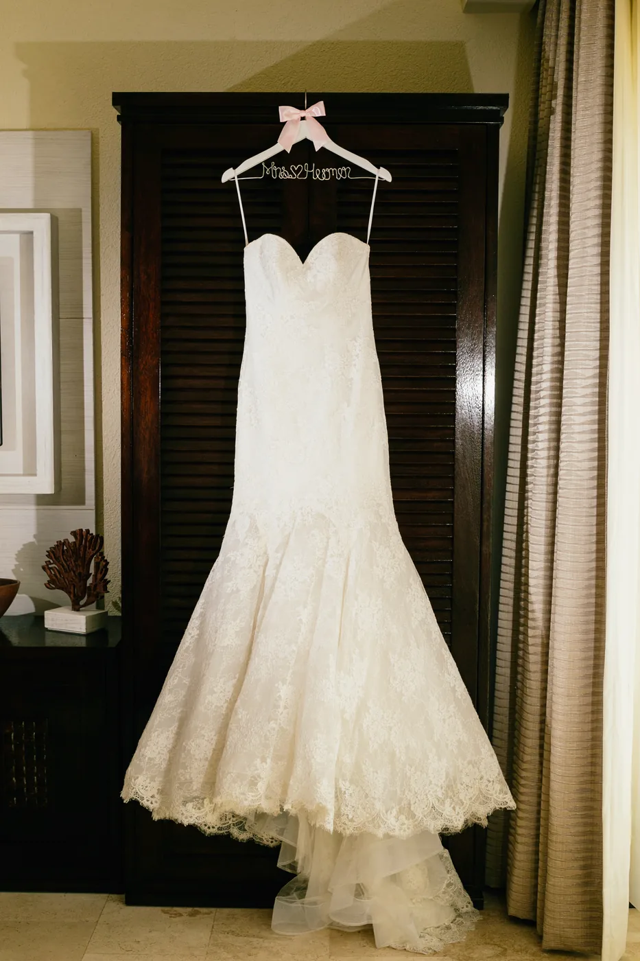 Wedding dress hanging in the light at Casa Dorada Los Cabos