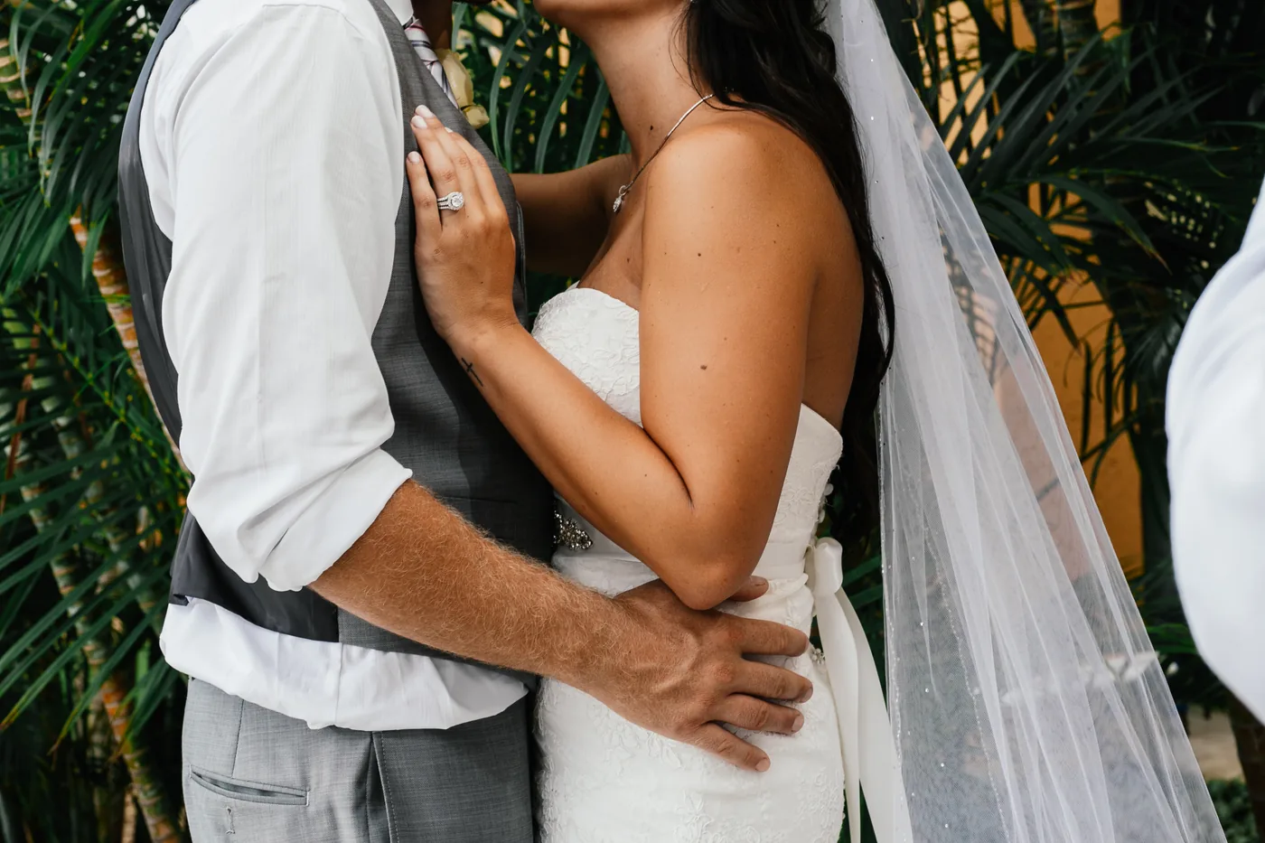 Bride and groom among the palms at Casa Dorada Los Cabos