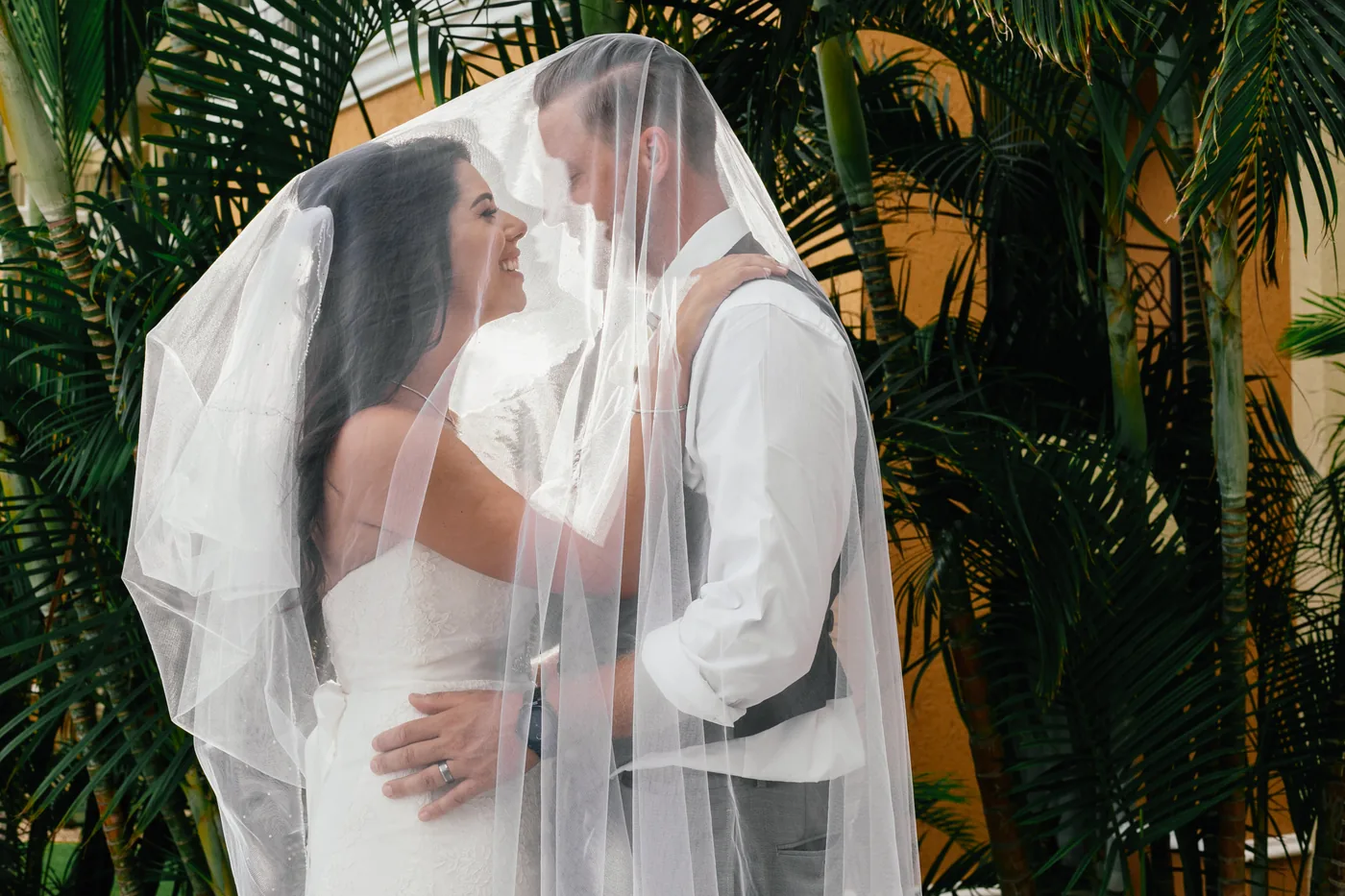 Couple under a veil at Casa Dorada Los Cabos