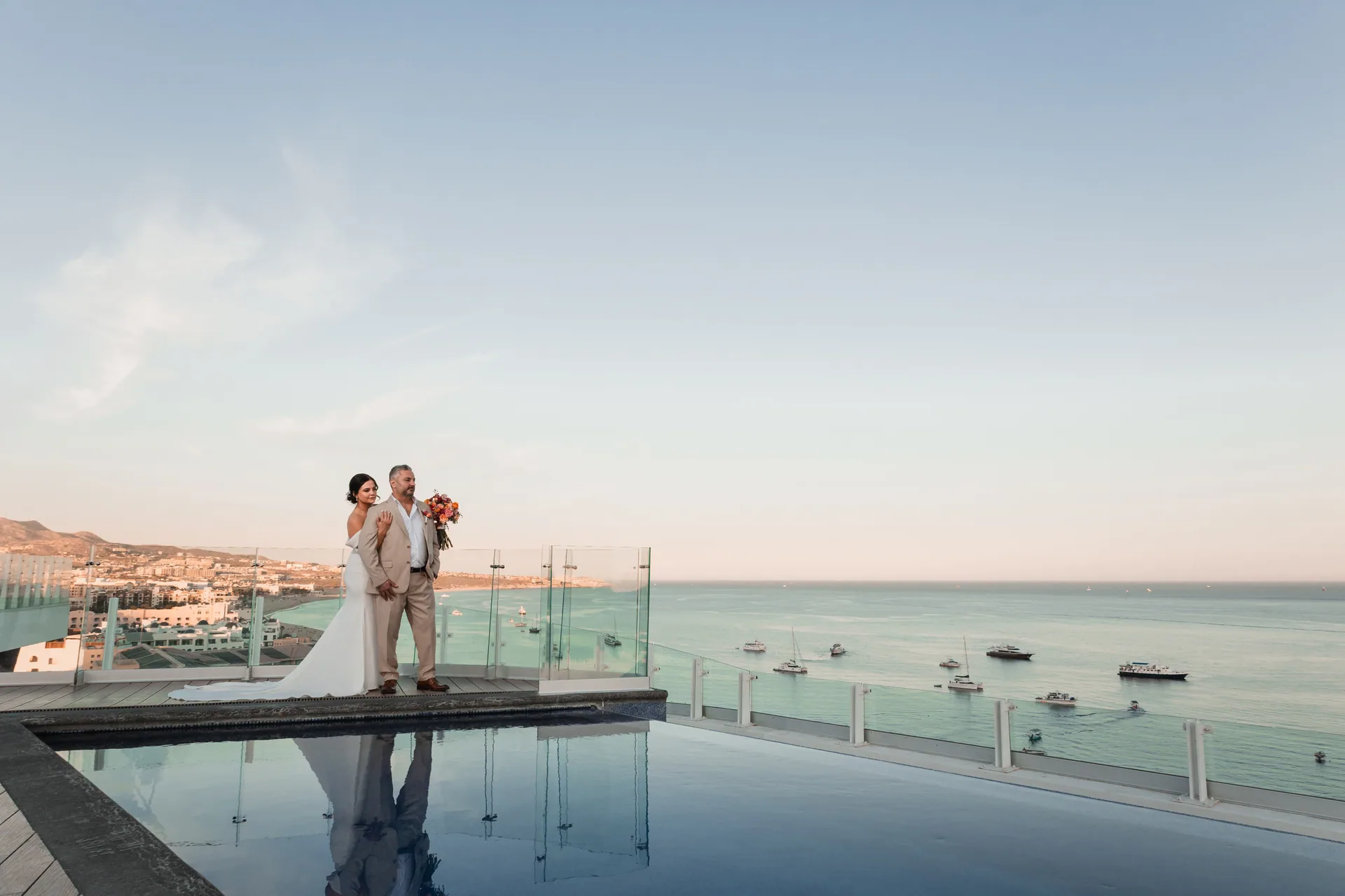 Couple at the infinity pool above the bay, Cabo San Lucas wedding