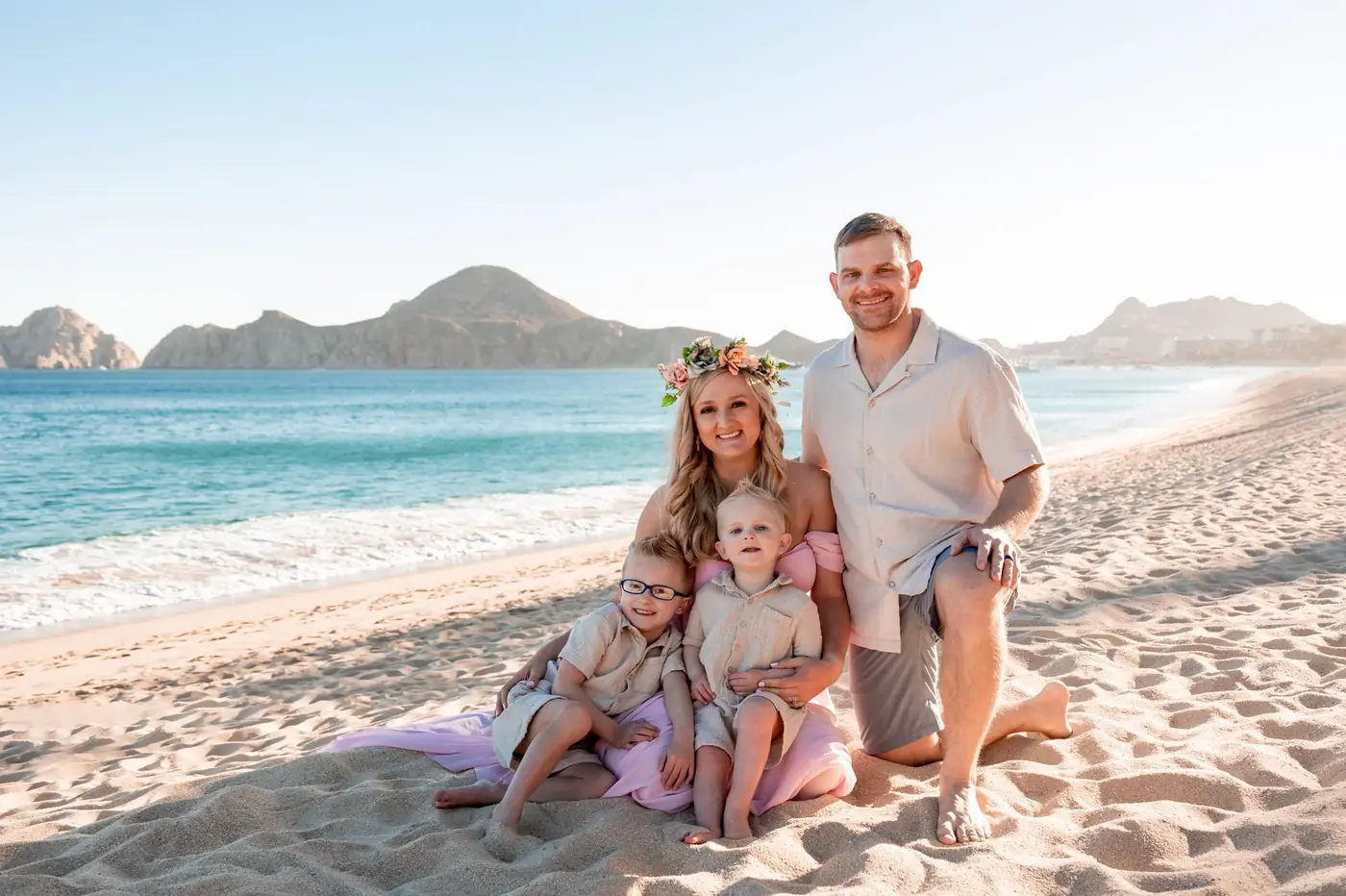 Family with flower crowns on the beach at golden hour, Cabo San Lucas family photography