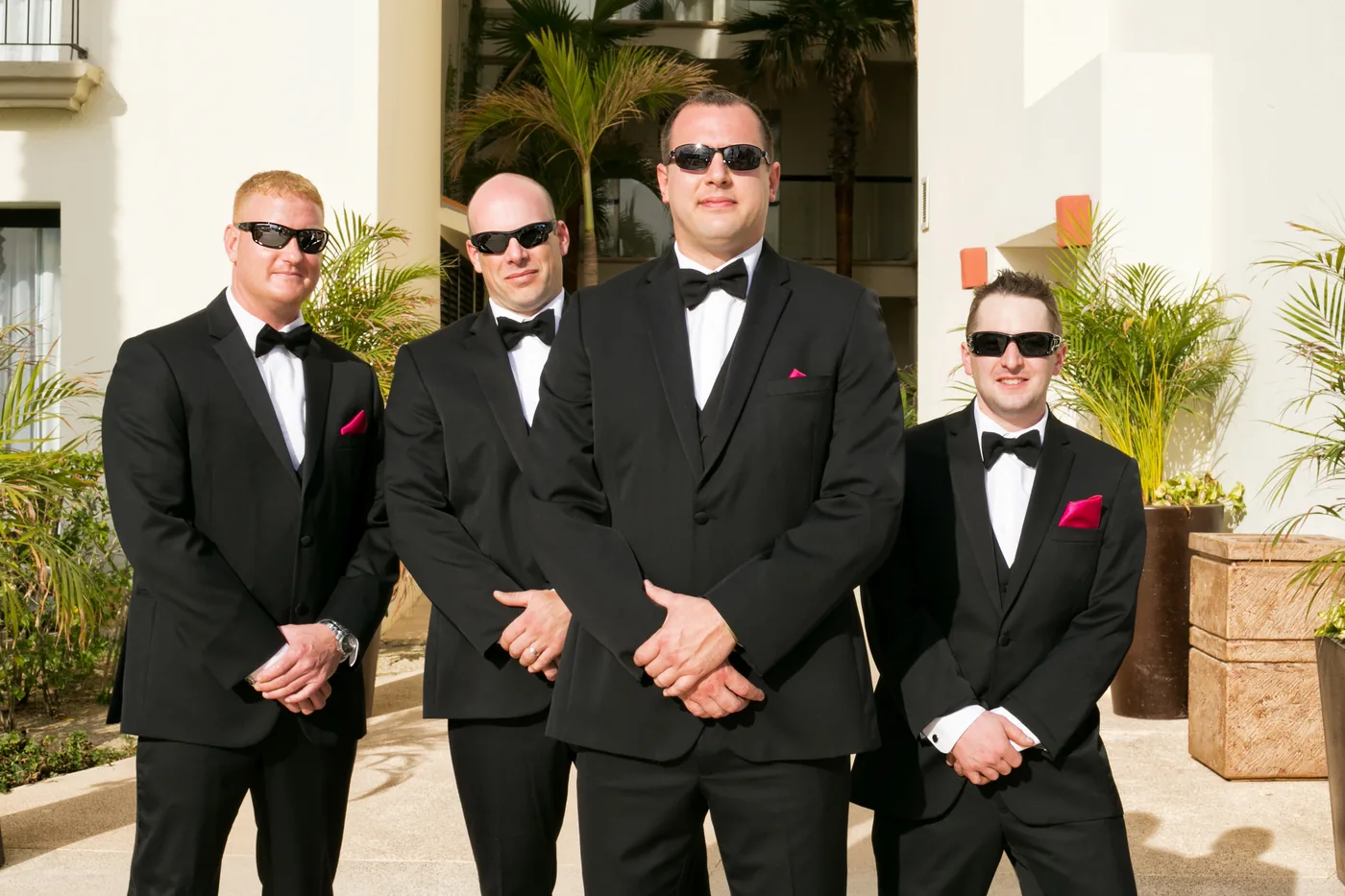 Groomsmen in black suits at a Hyatt Ziva Los Cabos wedding