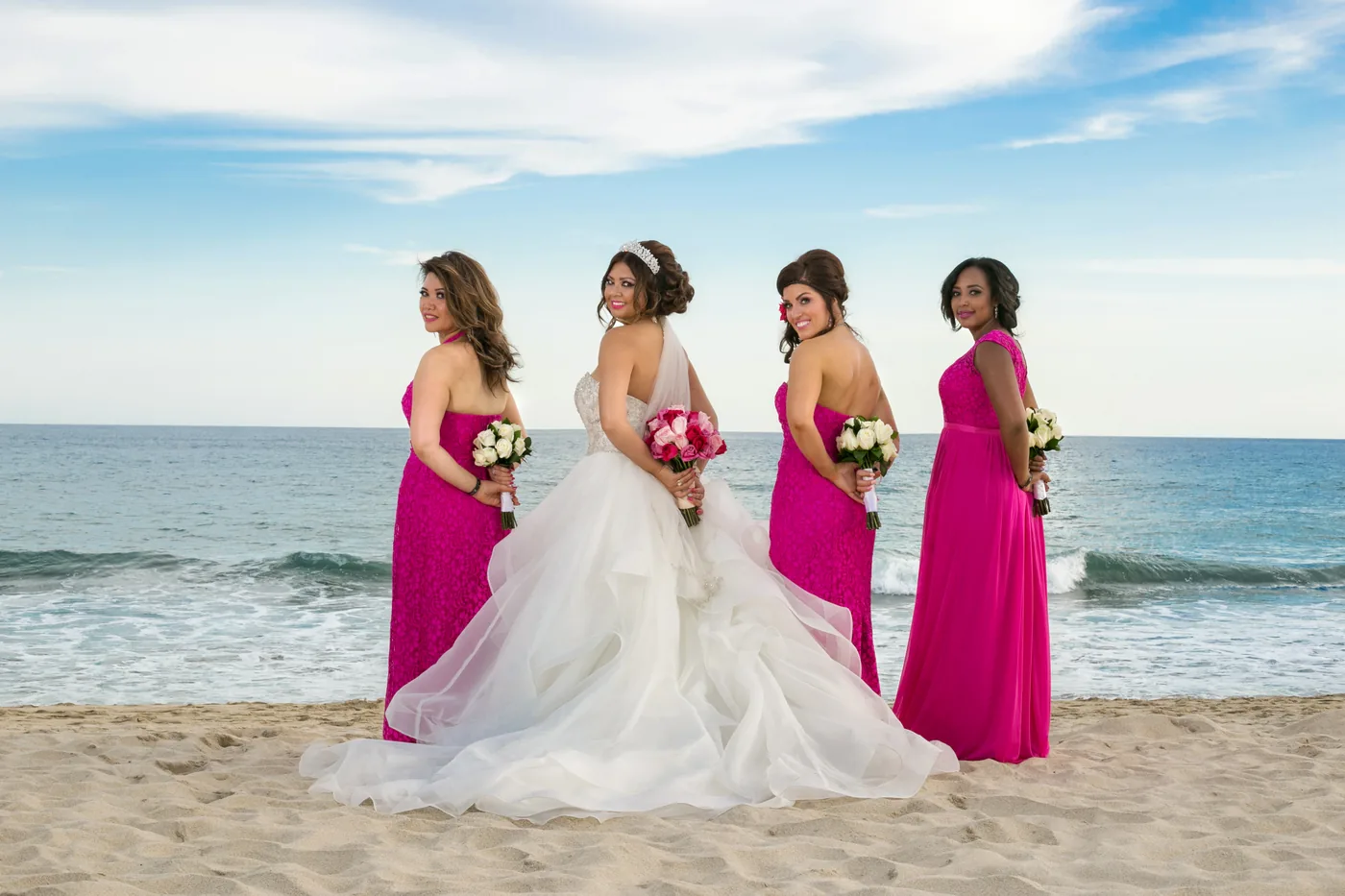 Bridesmaids in pink dresses on the beach at Hyatt Ziva Los Cabos