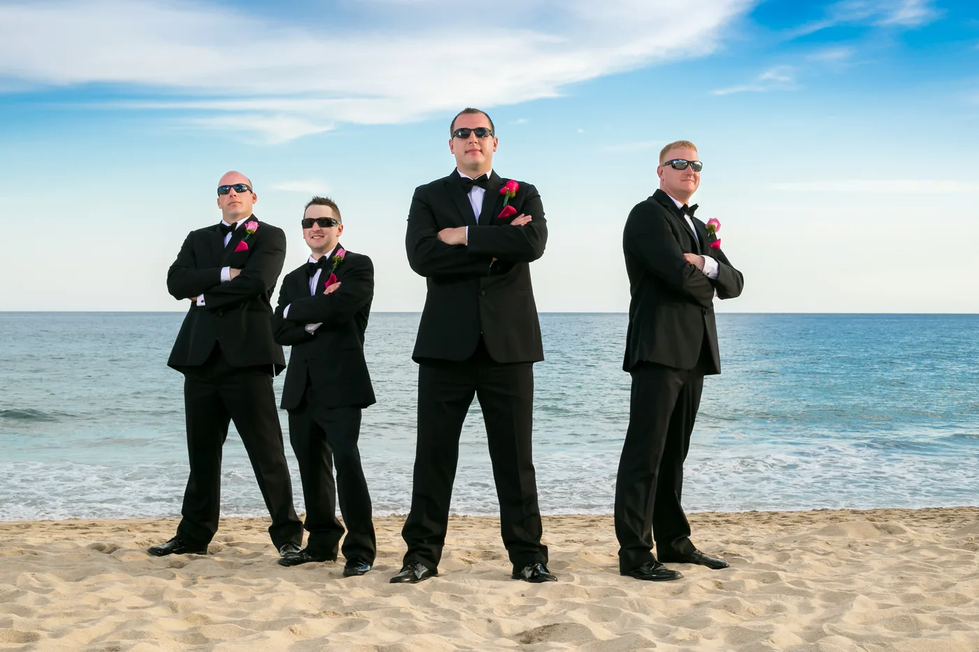 Groomsmen jumping on the beach at Hyatt Ziva Los Cabos