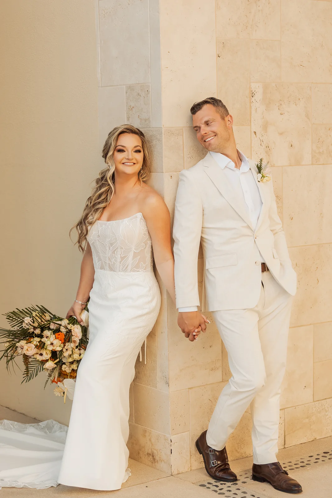 Bride and groom portrait against a wall at Pueblo Bonito Pacífica, Cabo San Lucas wedding
