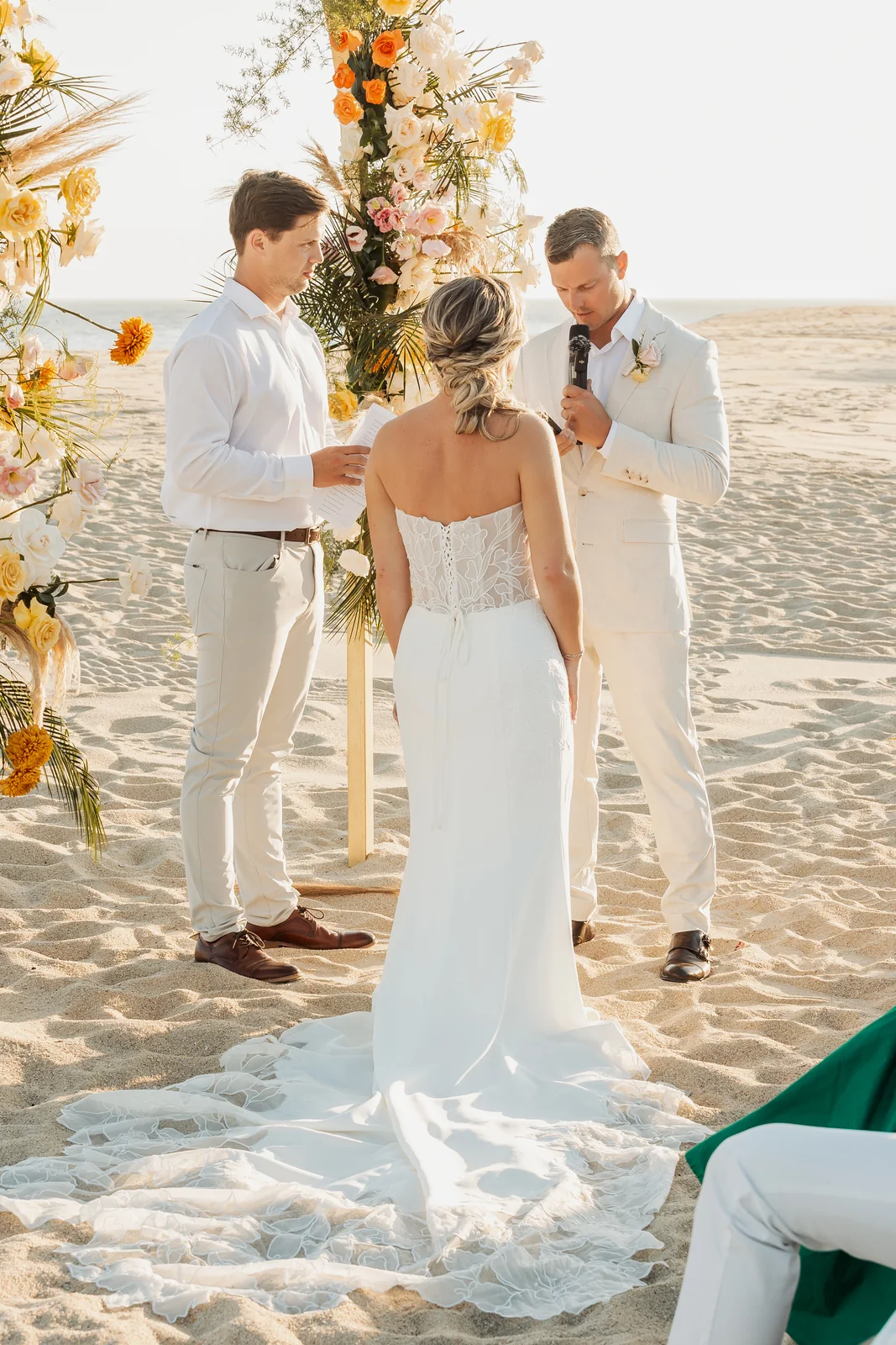 Wedding ceremony under the floral arch at Pueblo Bonito Pacífica, Cabo San Lucas