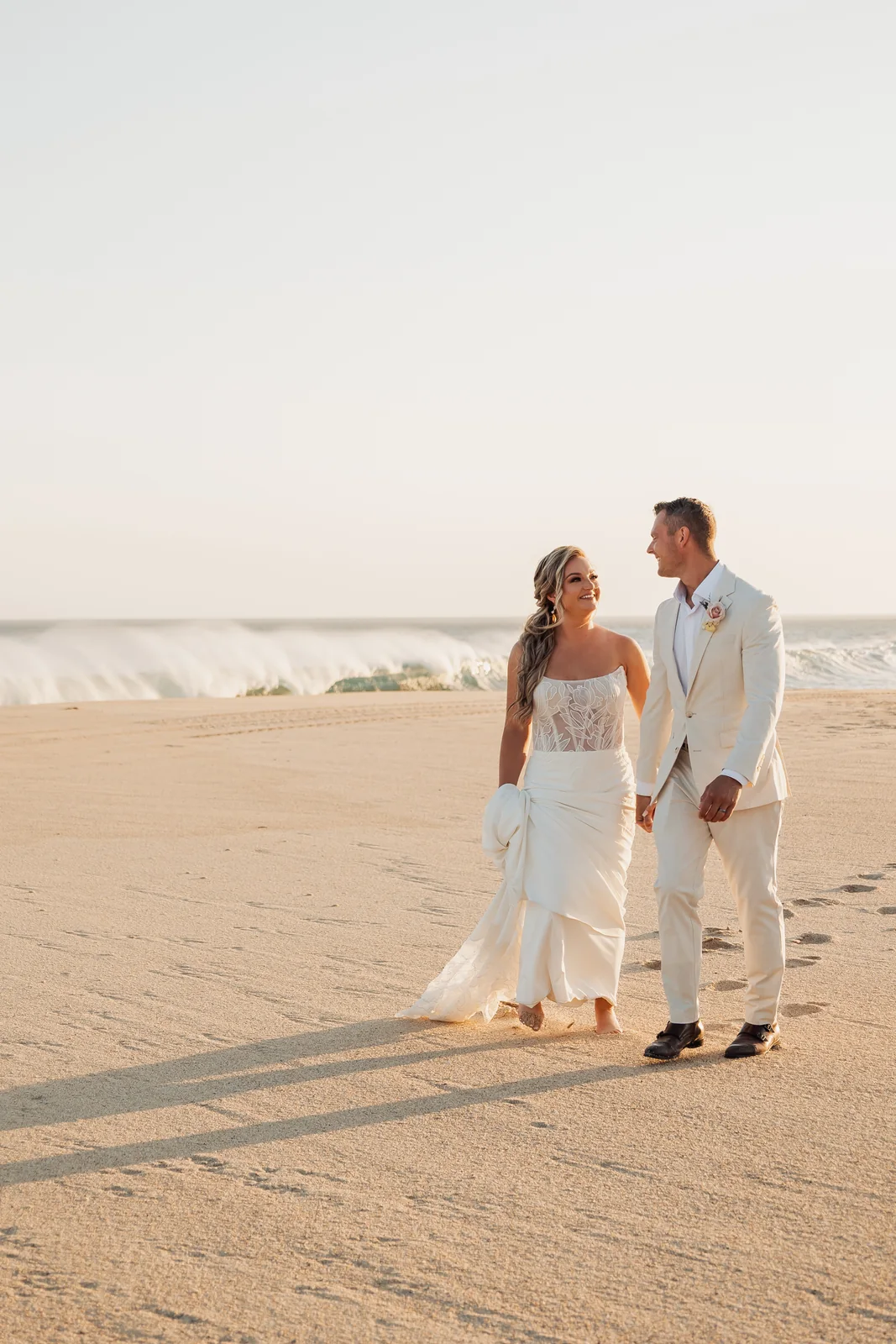 Couple walking on the beach at Pueblo Bonito Pacífica, Cabo San Lucas wedding