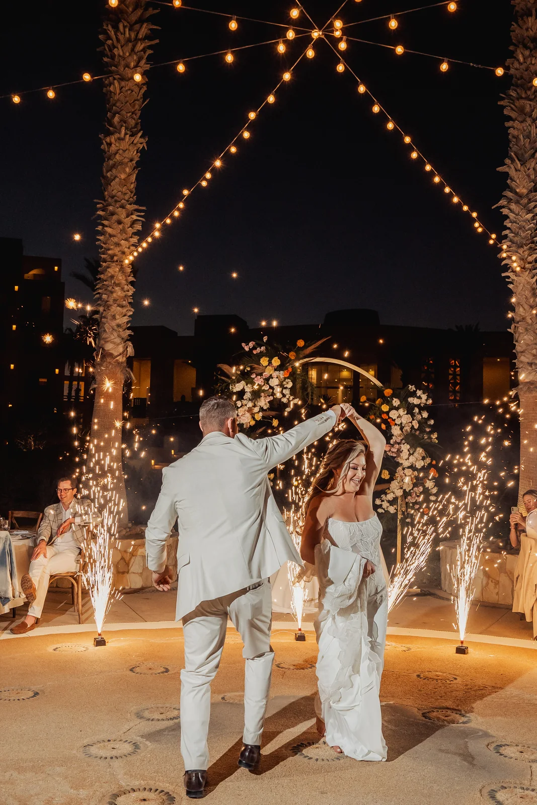 Couple leaving through a tunnel of sparklers at Pueblo Bonito Pacífica, Cabo San Lucas