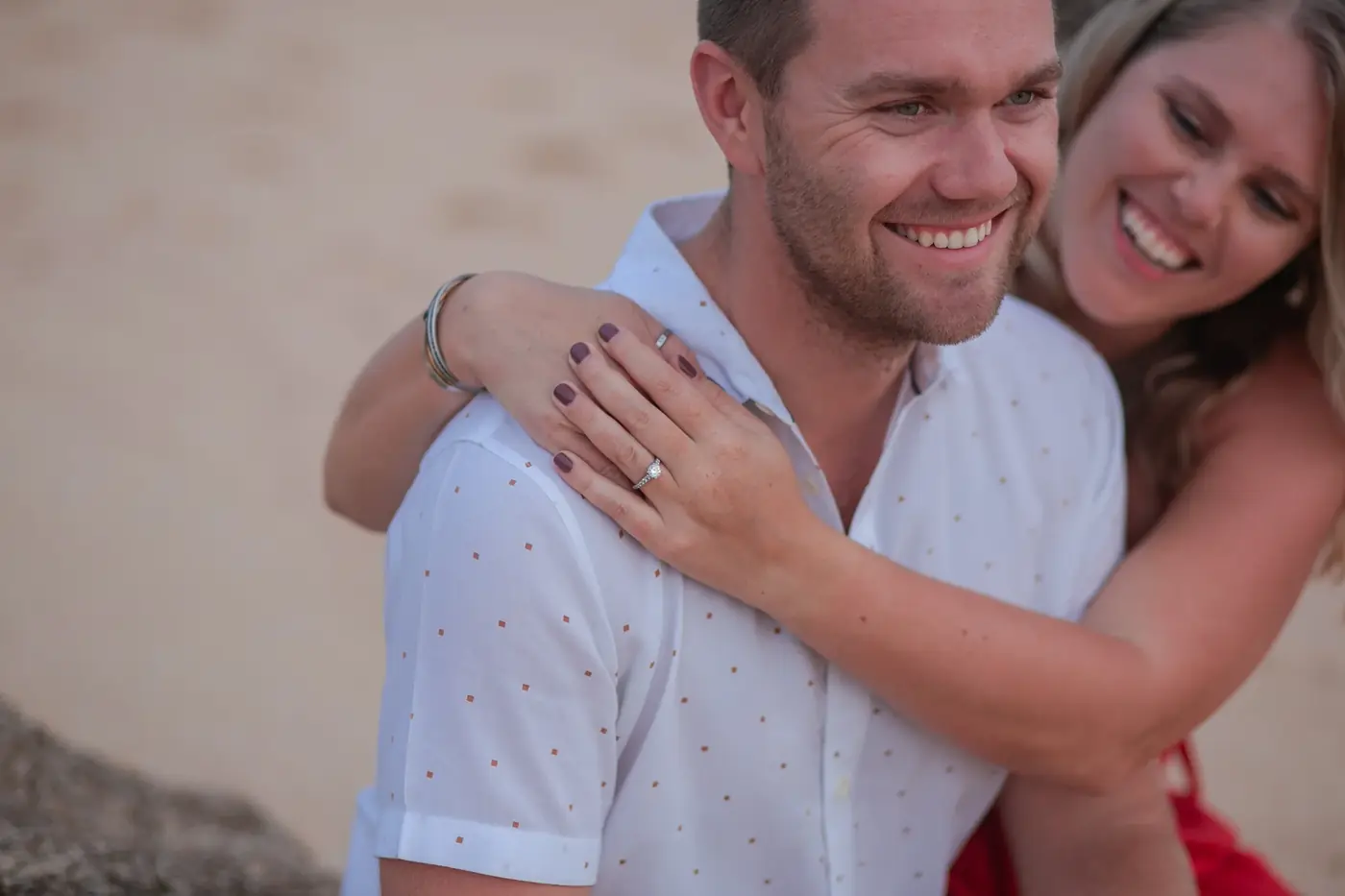 Engaged couple embracing during a couples session in Cabo San Lucas