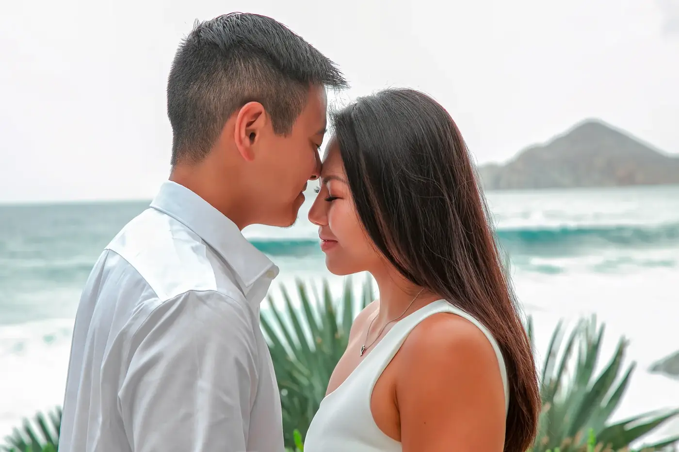 Couple forehead to forehead on the beach, Cabo San Lucas couples session