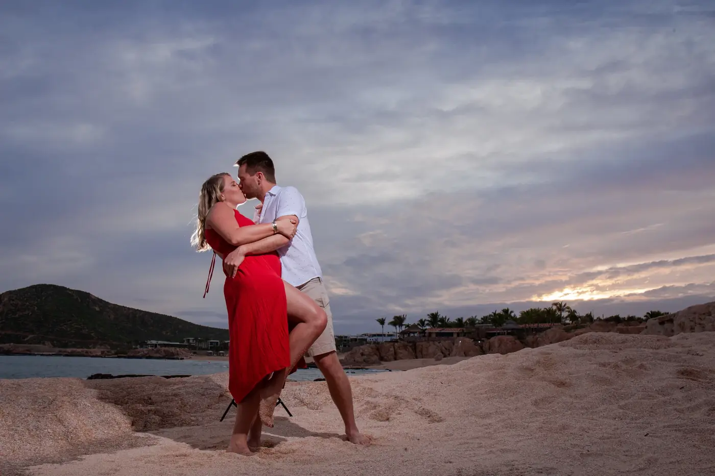 Intimate moment between a couple on the beach during a Cabo San Lucas engagement session