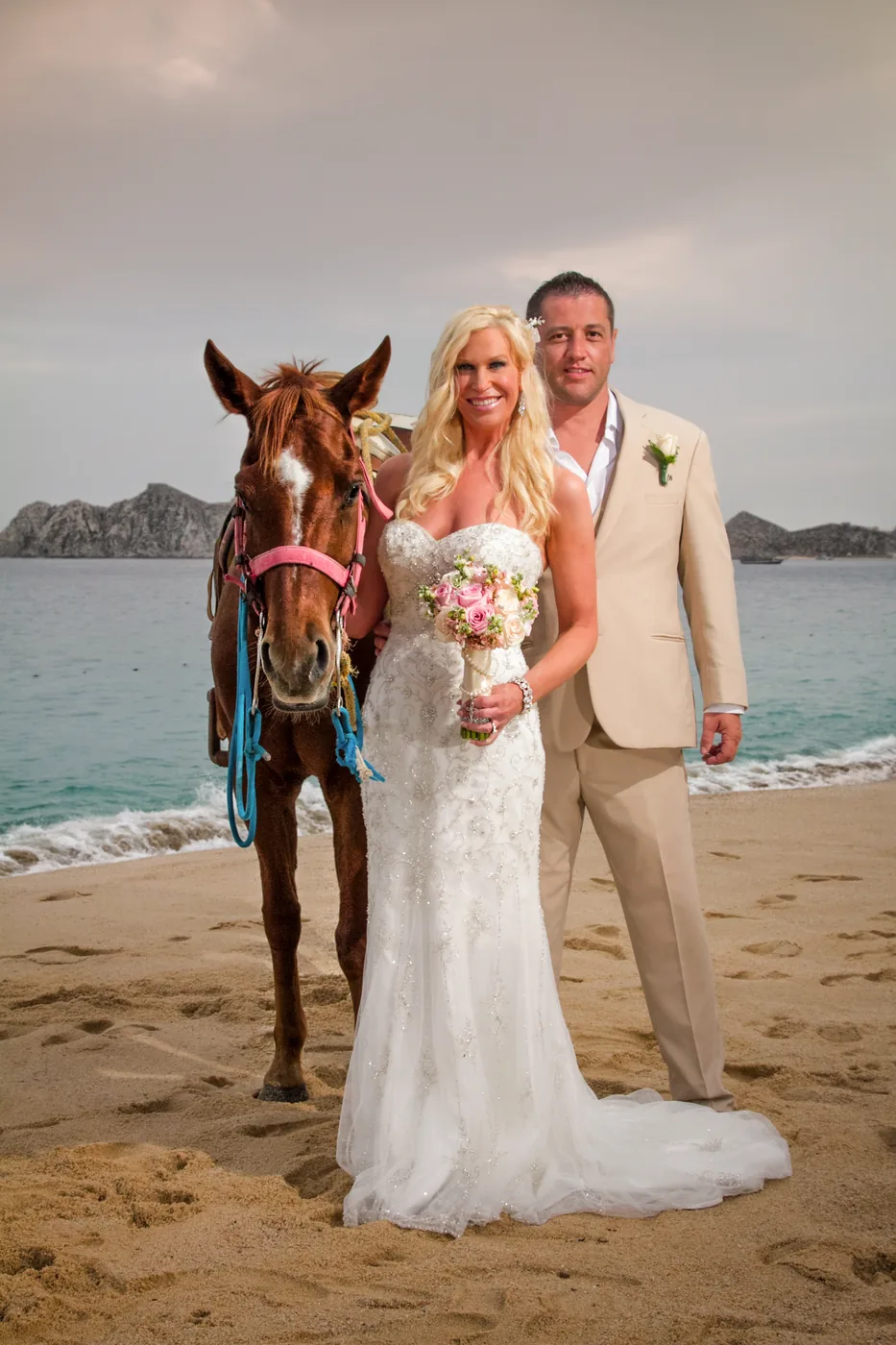 Bride and groom on the beach at RIU Palace Cabo San Lucas