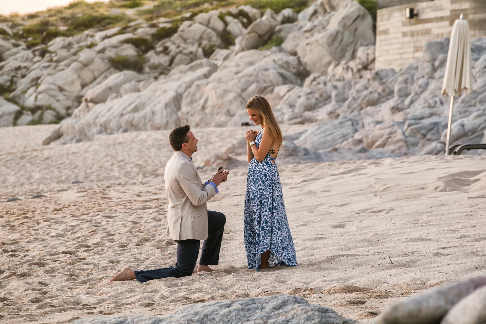 Surprise proposal on the beach at The Cape, a Thompson Hotel in Cabo San Lucas at sunset