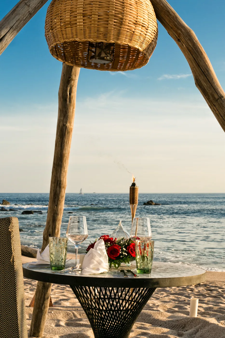 Champagne and a table for two beside the ocean at The Cape in Cabo San Lucas