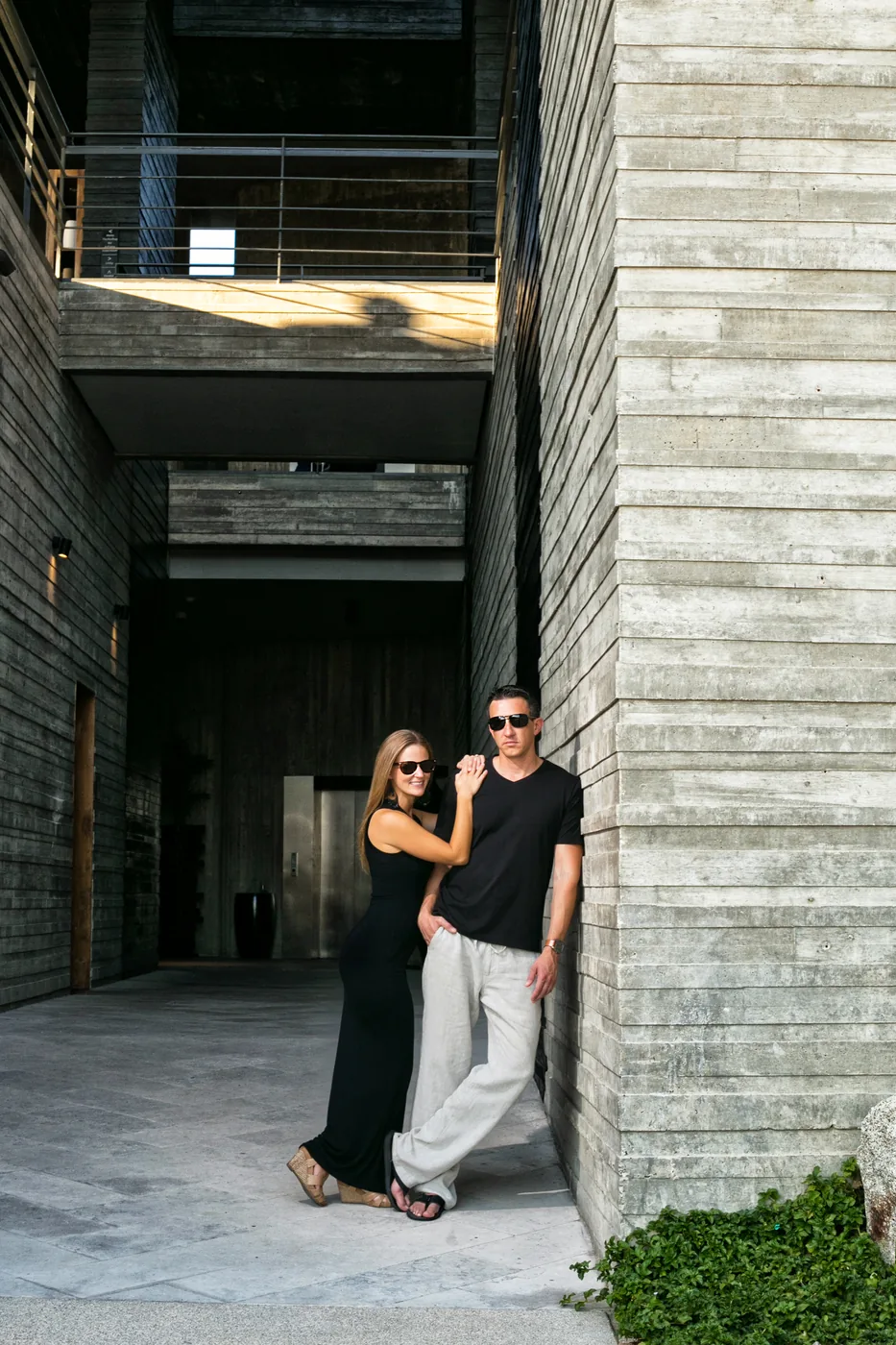 Couple walking through the modern corridors of The Cape Thompson Hotel in Cabo