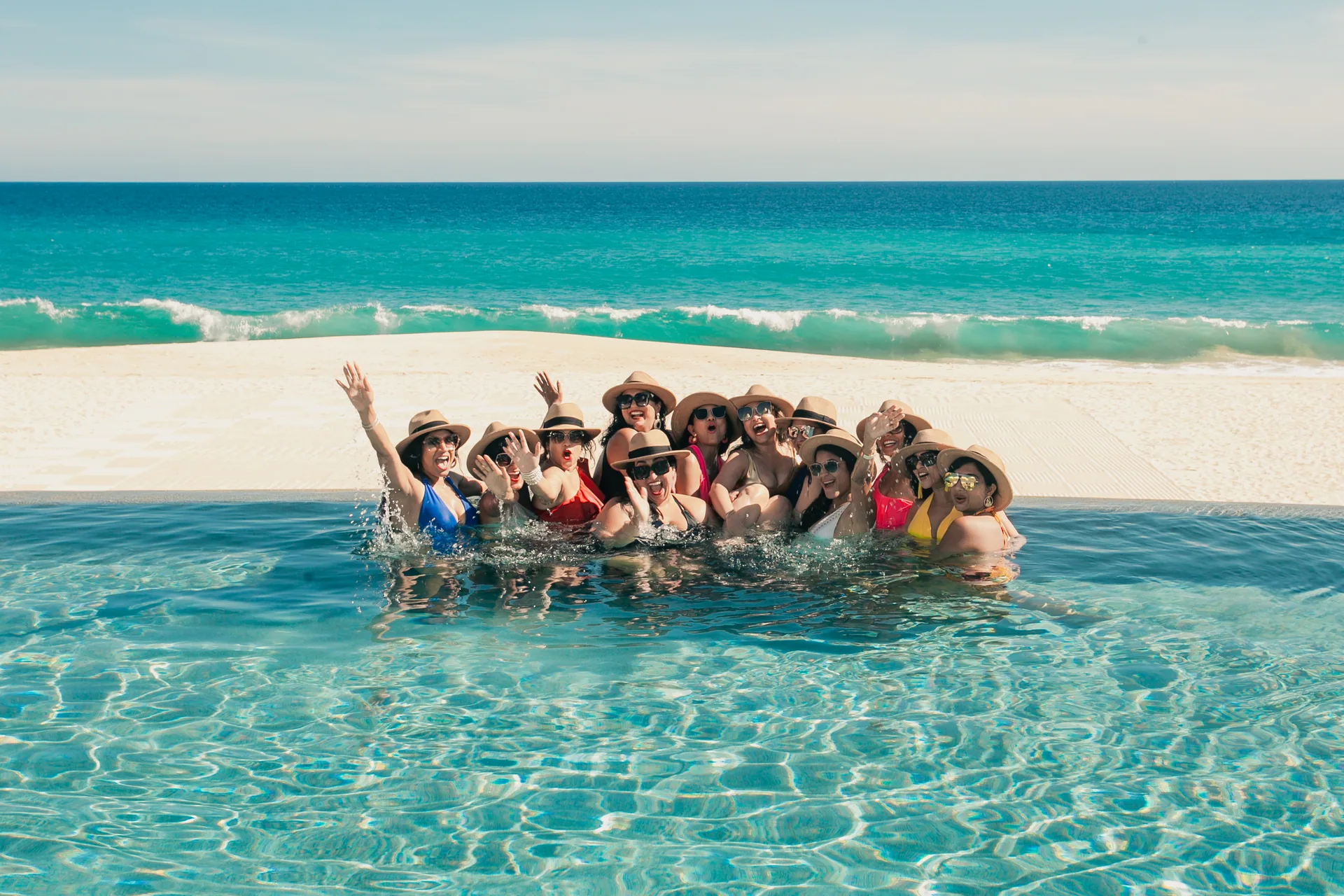 Bachelorette group celebrating in the water in Los Cabos